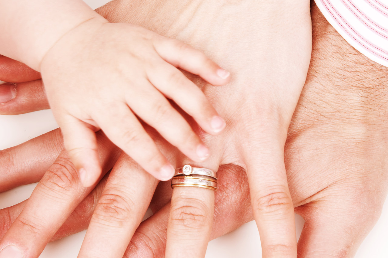 Hands Together Hands of father, mother and their baby on each other